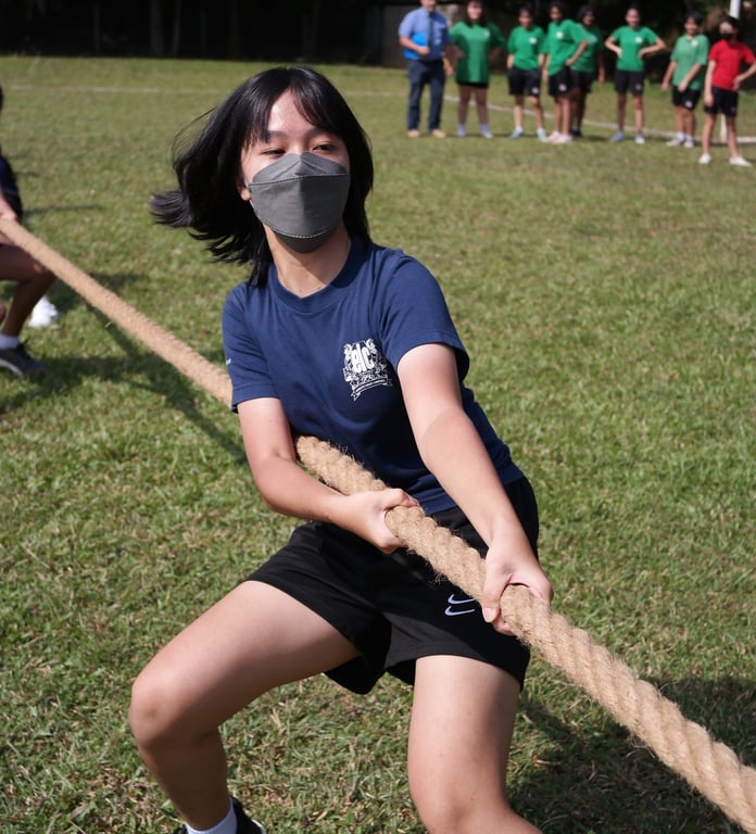 House teams competing in tug-of-war during Sports Week.