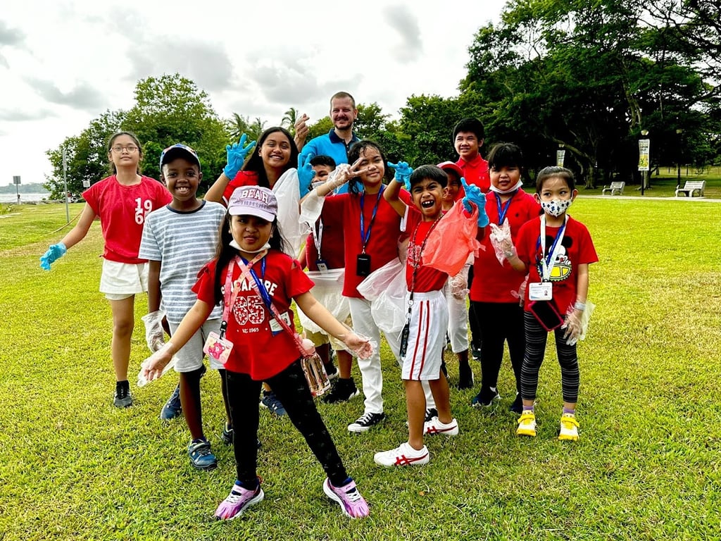Students take part in a community event helping to clean up the local park