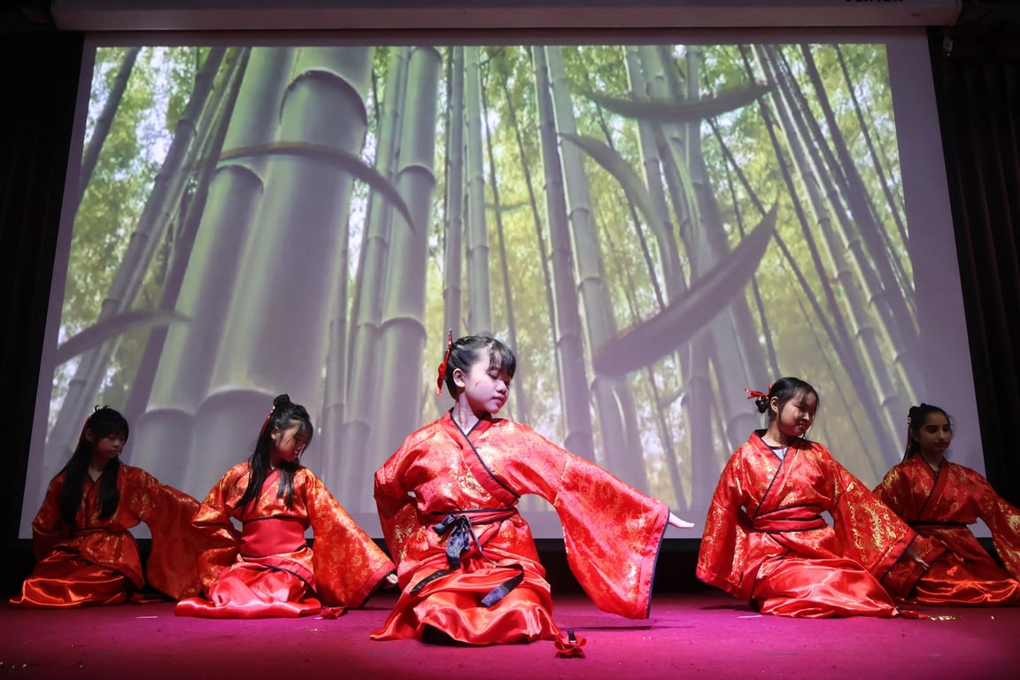Students performing traditional songs and dances for Chinese New Year.