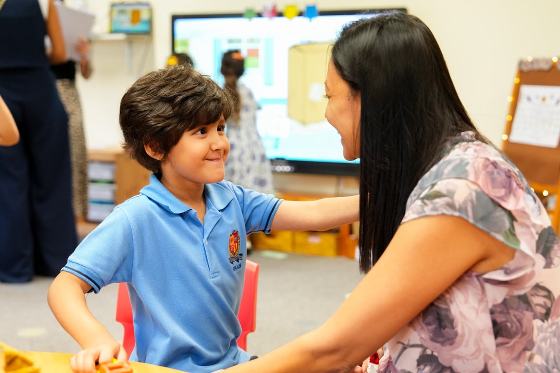 A Parent joining their child for a hands-on 'Learn Together' classroom session.