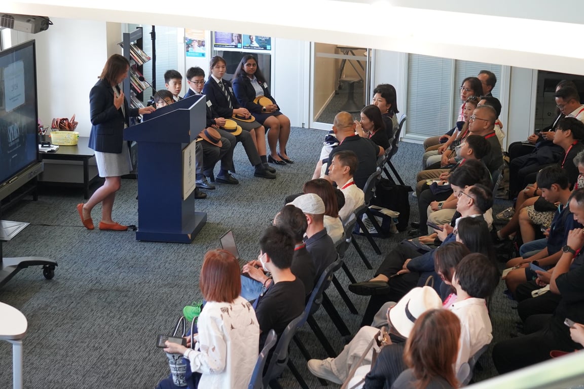 Potential families in an informative session during an open day.