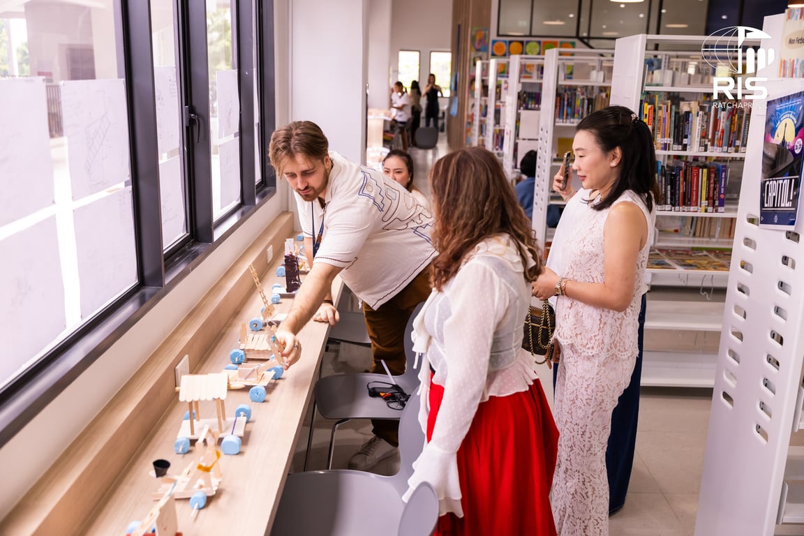 Parents attend an elementary Art & STREAM Exhibition, showcasing creativity, inquiry, and innovation through hands-on projects across disciplines.