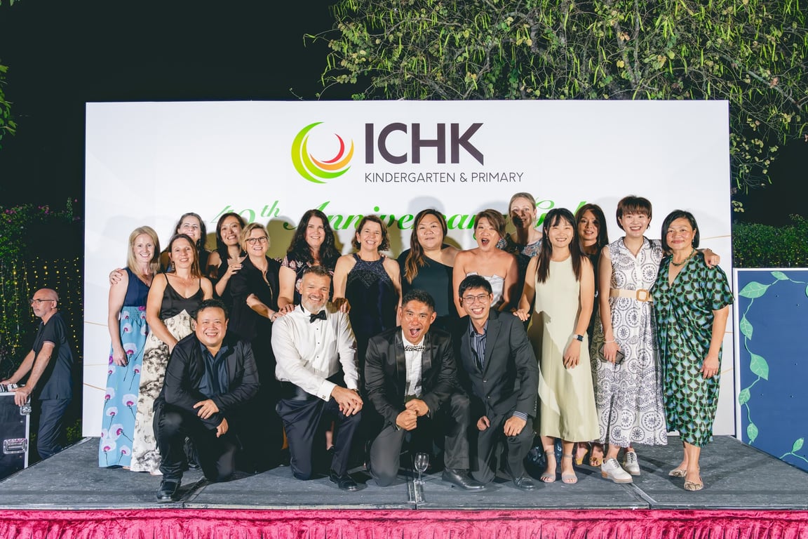 THe CIHK community posing together at ICHK Primary's 40th Anniversary gala.