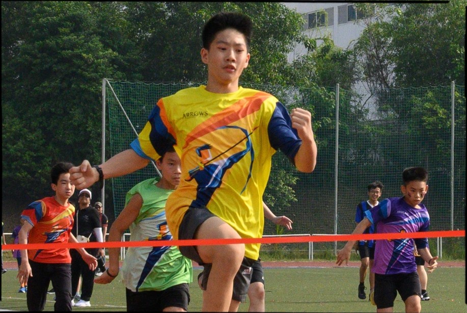 A student participating in a hurdle race on the School's Annual Sports day.