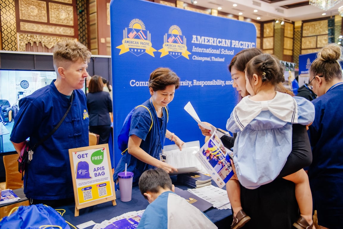 APIS team meeting families at the Chiang Mai Education Fair 2025.