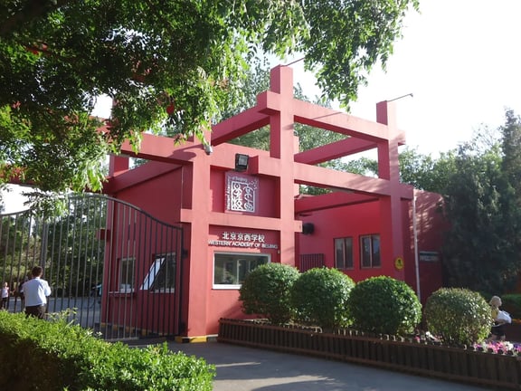Contemporary architecture reflecting traditional Chinese structural design at the WAB campus entrance.