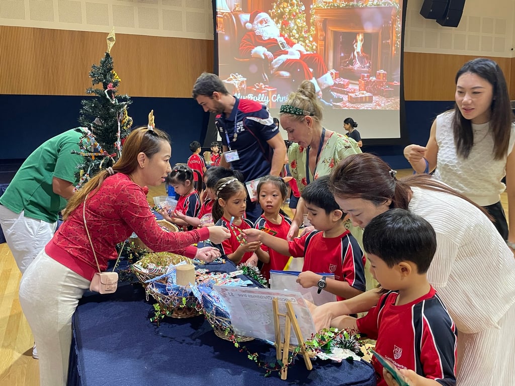Stamford American International School Early Years students at the Winter Fundraiser Fair selling their handmade festive creations inspired by cultural traditions. 