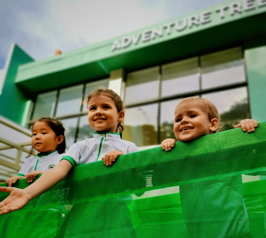 Children smiling outside the preschool building in Katong.