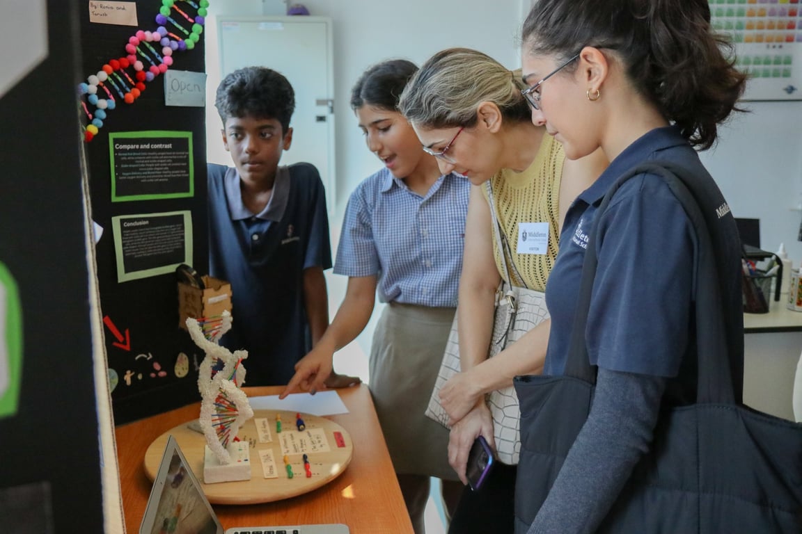 Students present their classroom projects as parents are welcomed into the classroom