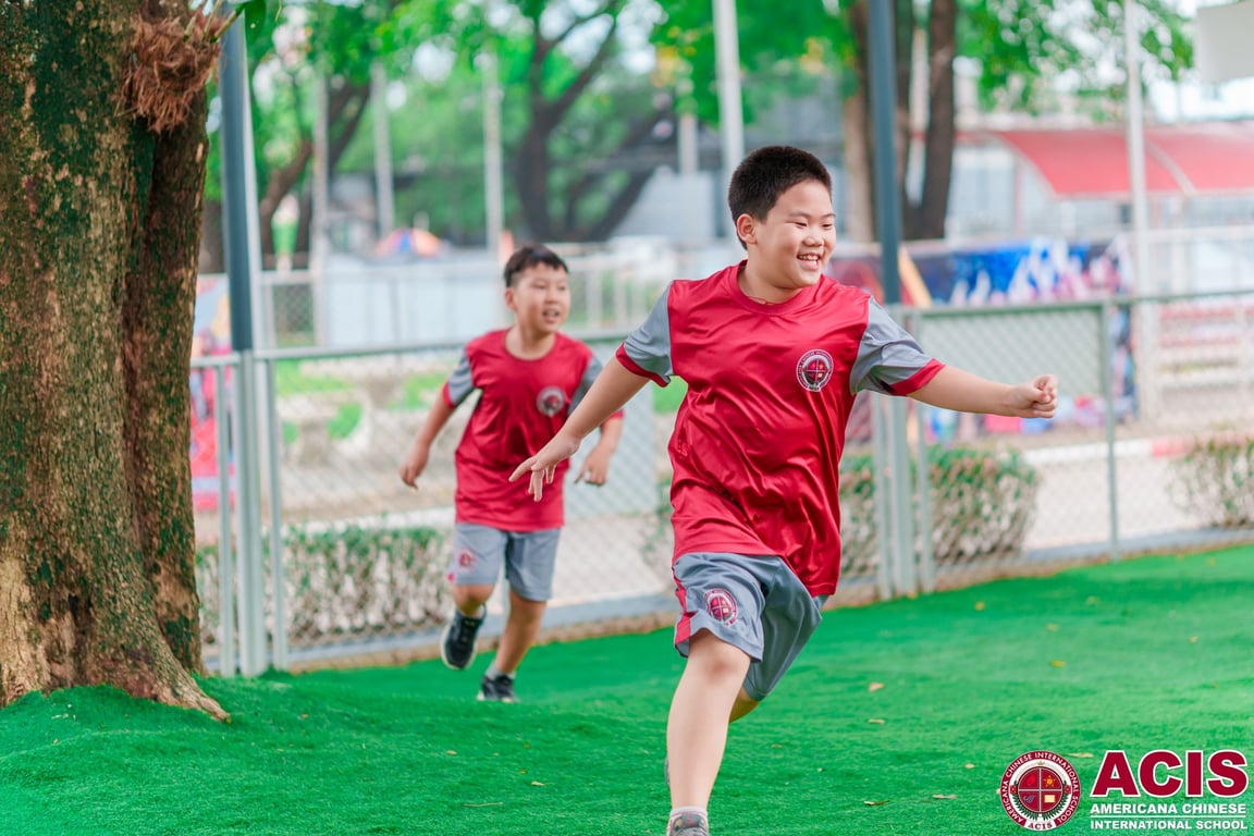 Students enjoying an active and joyful lunch break outdoors.