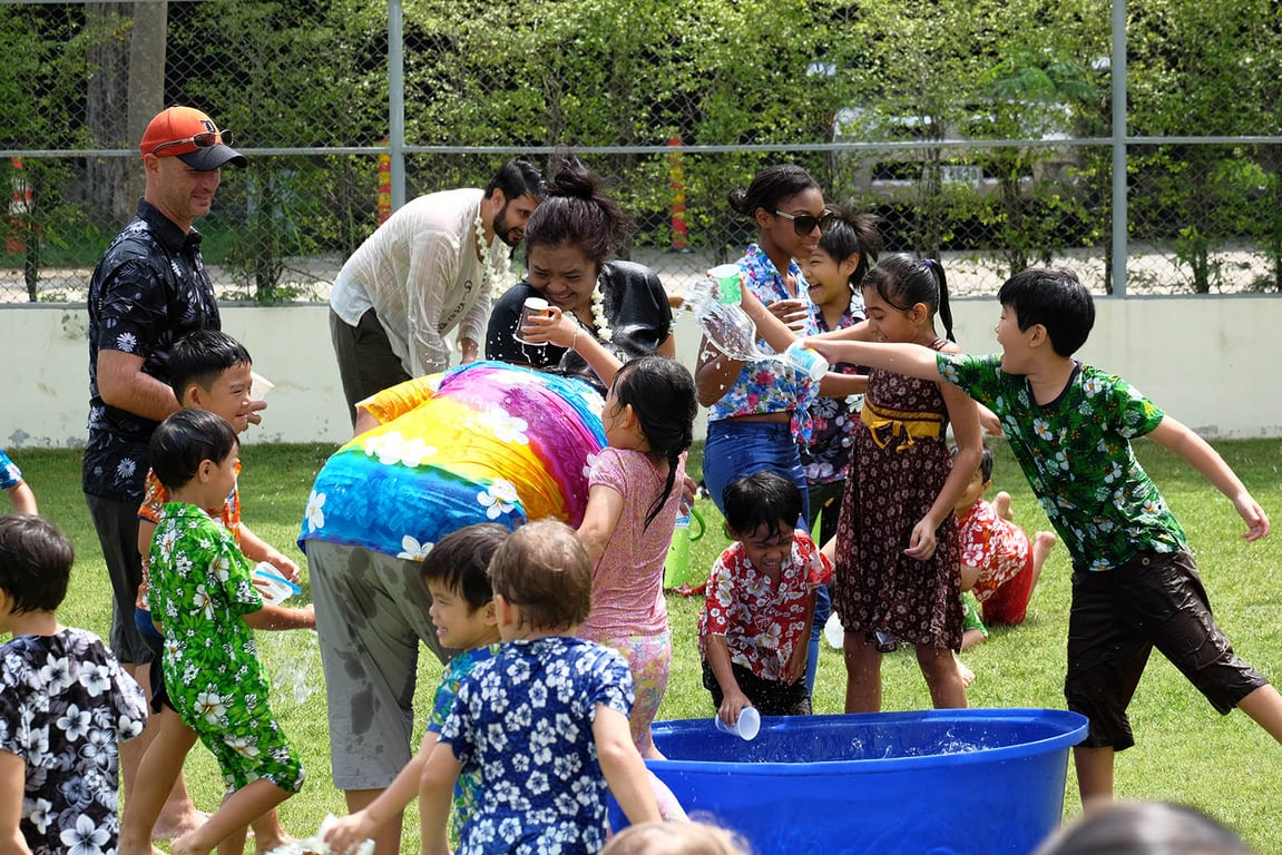 Students and staff enjoying the Songkran water celebration.