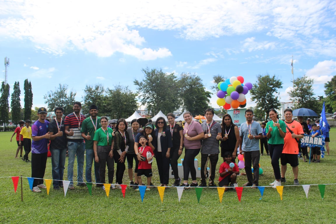 School community celebrating together after Sports Day medal presentations.