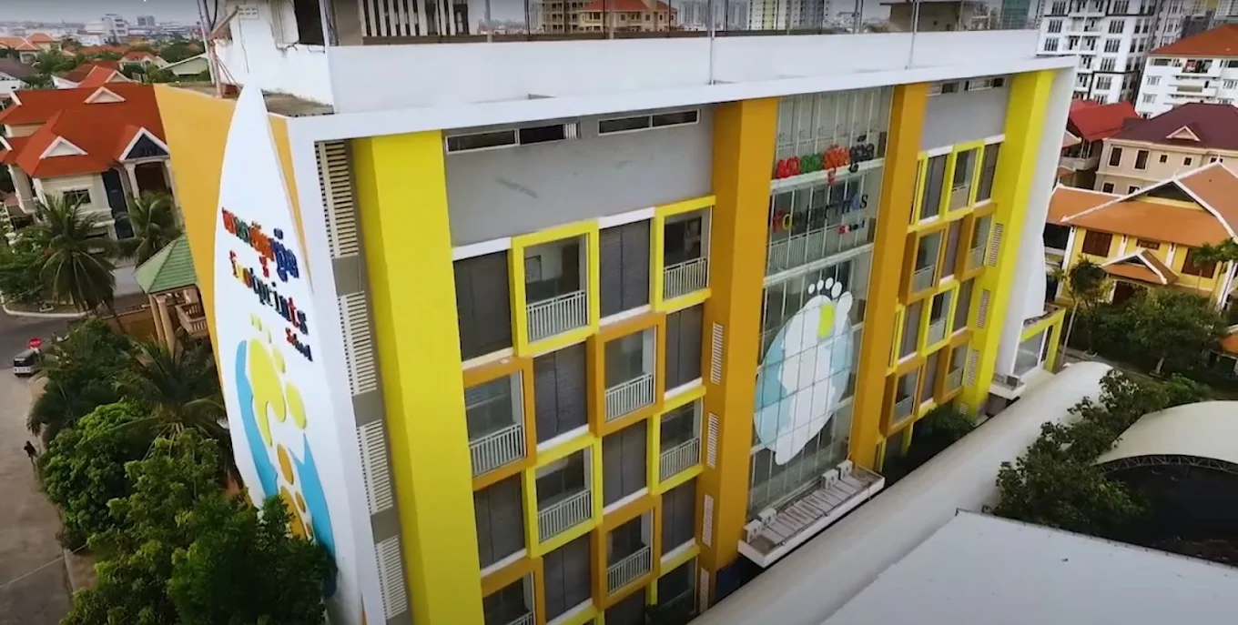 Multi-story academic buildings at Footprints International School.