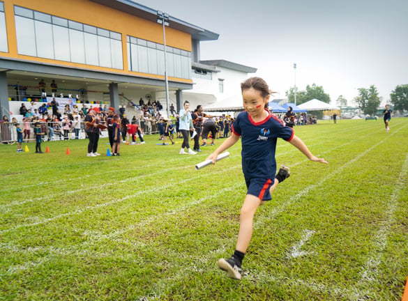 Student racing in the relay at MISKL Sports Day 2025.