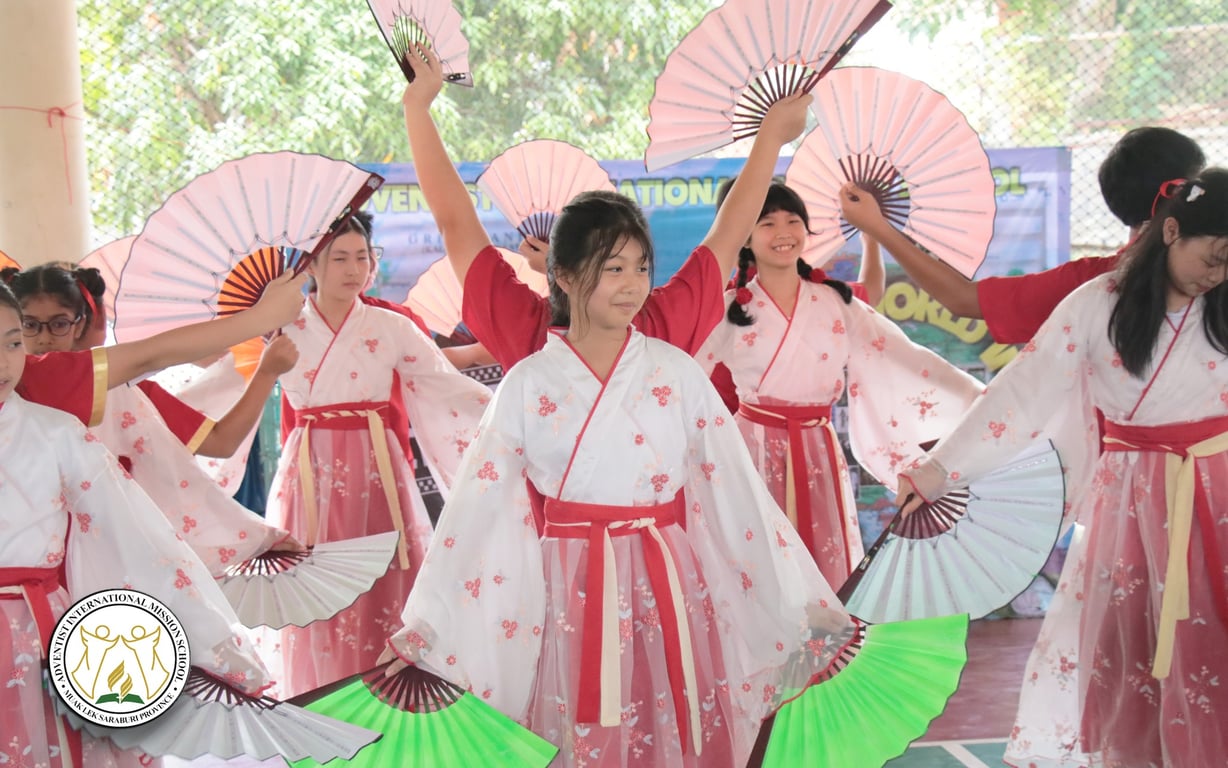 Students performing a traditional fan dance for International Day.