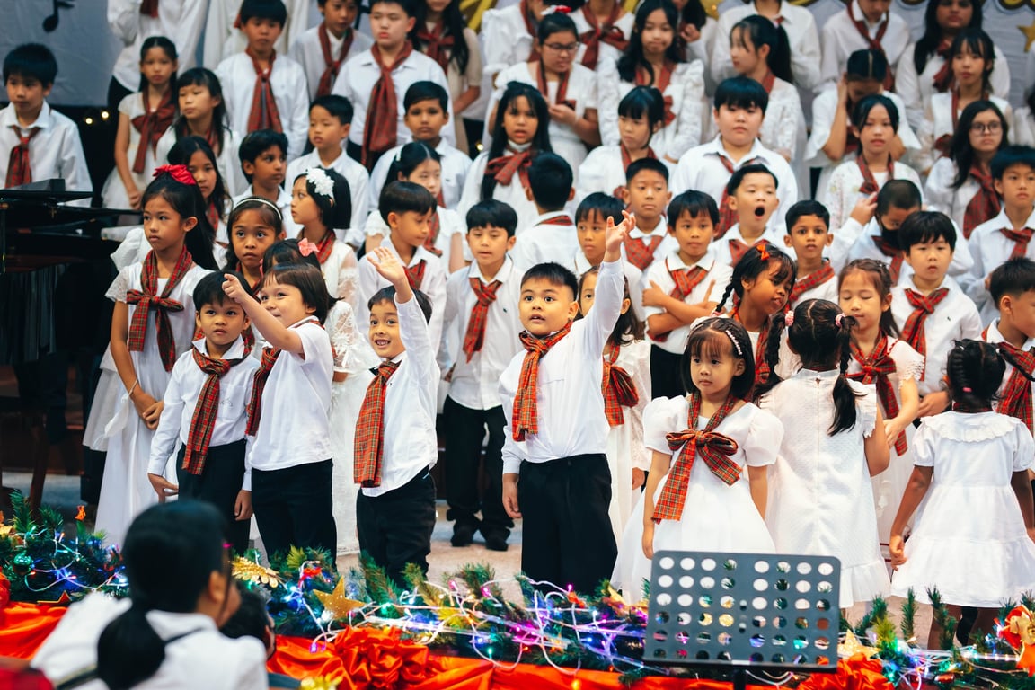 Students performing on stage during Christmas concert.