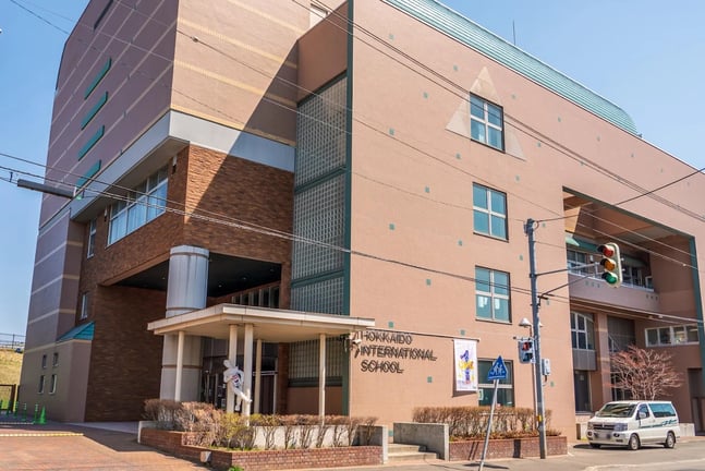 An exterior view of the multi-story school building.