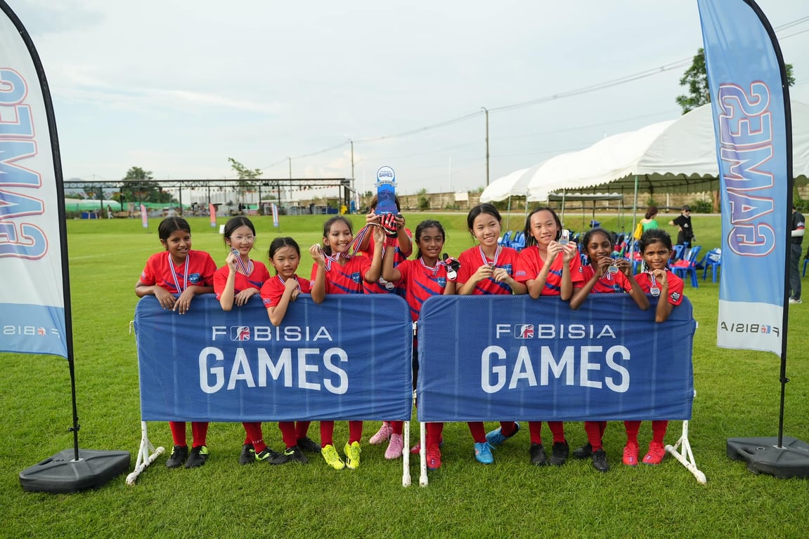 SKIS athletes celebrating their victory in the U11 FOBISIA games, an international tournament of schools held in Thailand
