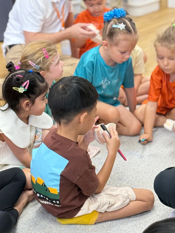Young students practicing tooth brushing during a school dental health activity.