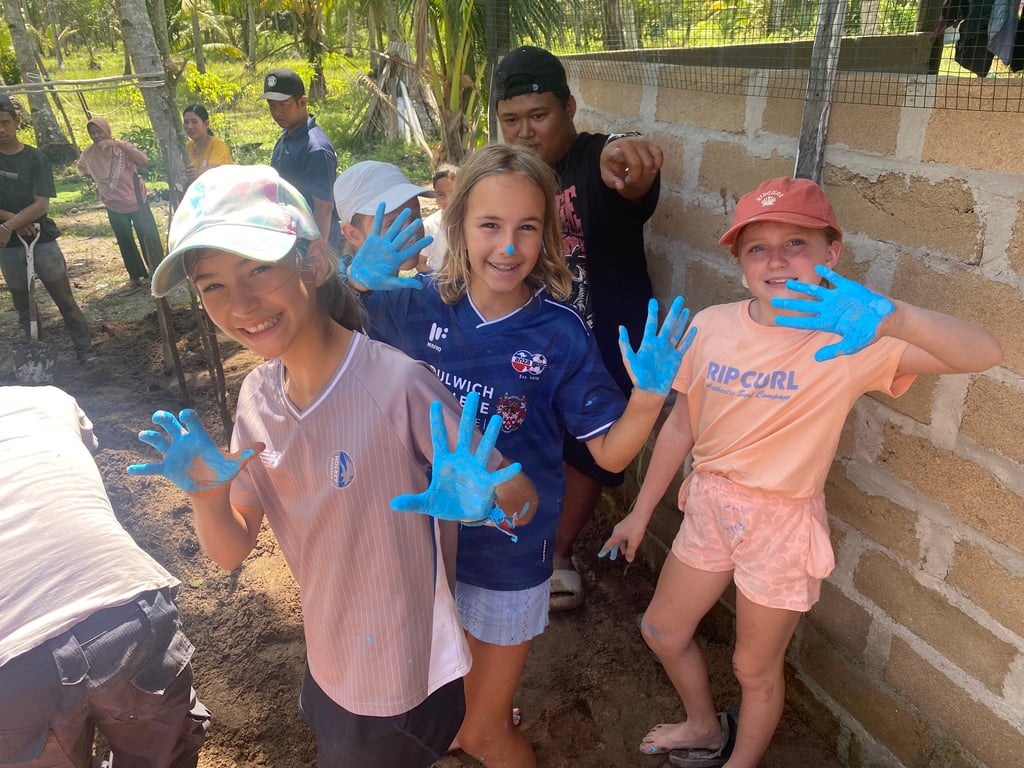 Students helping in a sustainable project as part of their school camp
