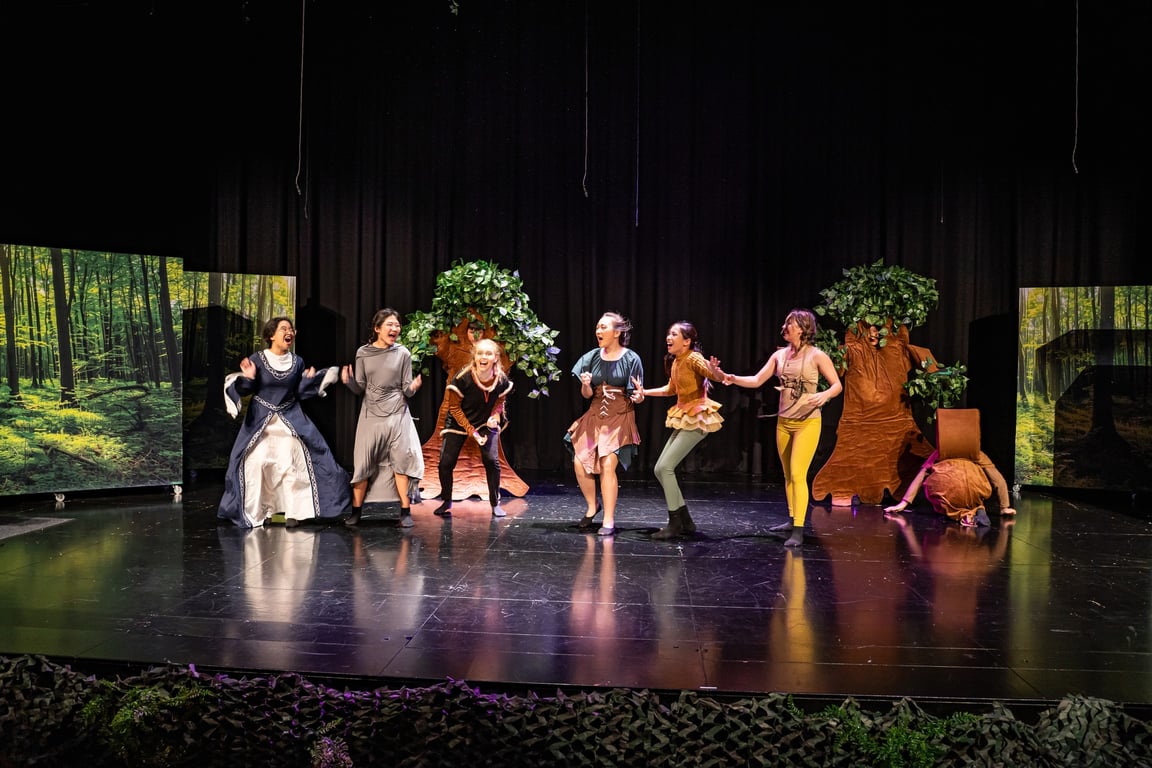Students perform a lively scene from the Robin Hood stage production.