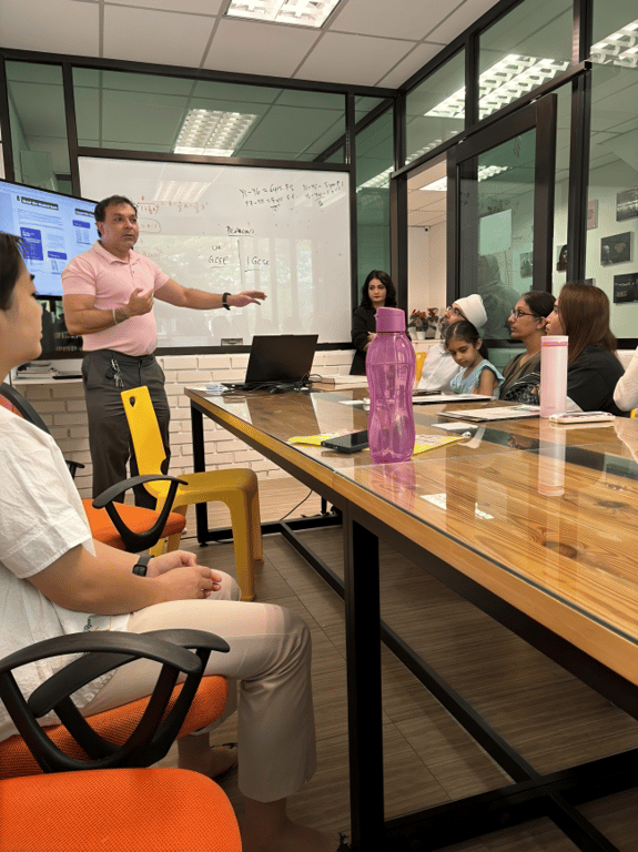 "A teacher briefing parents and students about academic pathways.