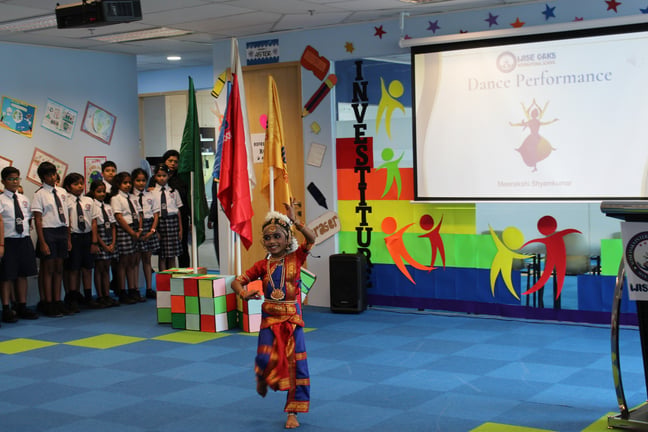 A student performing a cultural dance at Wise Oaks' Investiture ceremony, where the student council is confirmed