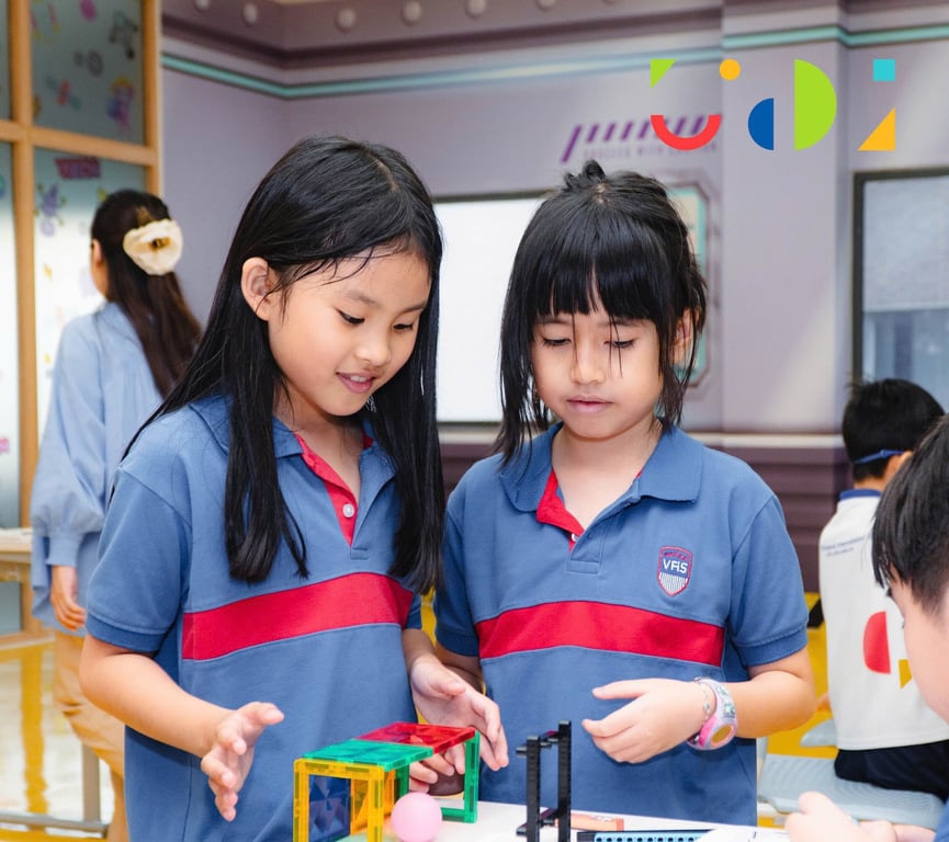 Students working together on a classroom building activity.