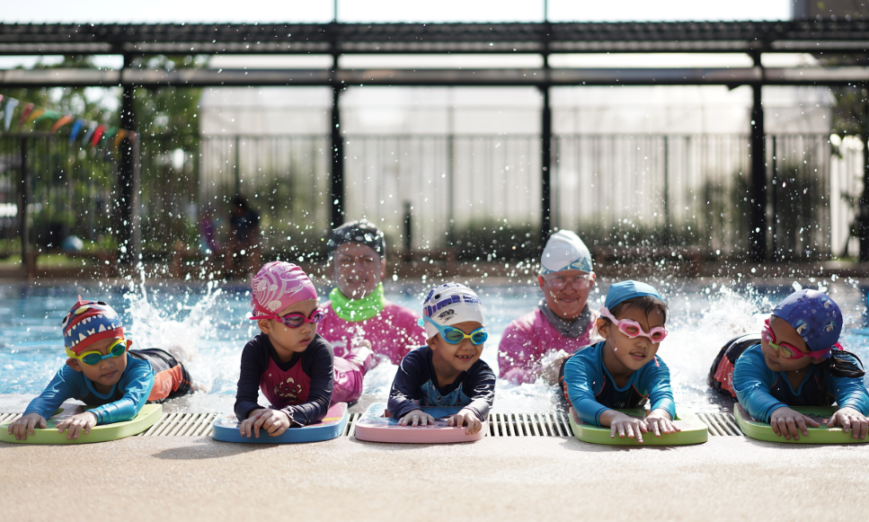 Little swimmers having fun while building skills in the pool.