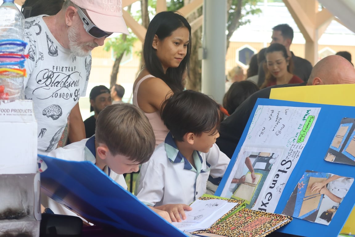 Children present their science and design projects to parents and teachers at STEM Expo.
