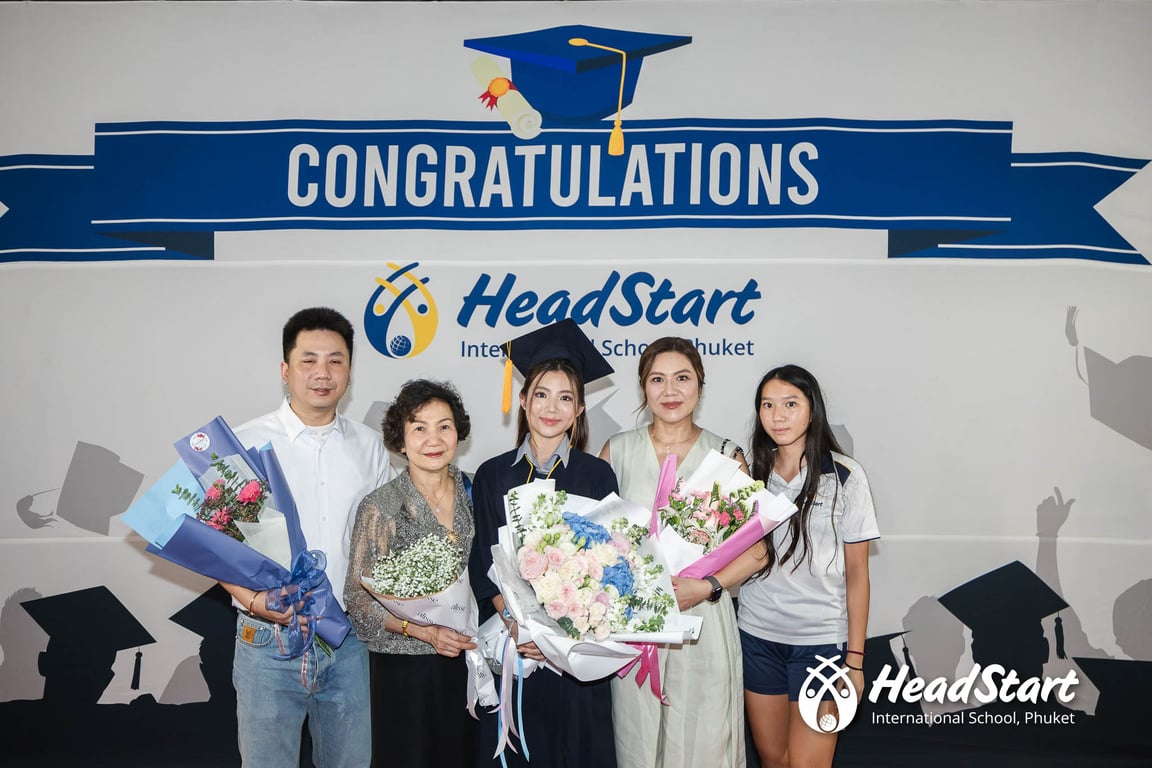 A HeadStart graduate poses with family during the Class of 2025 celebration.