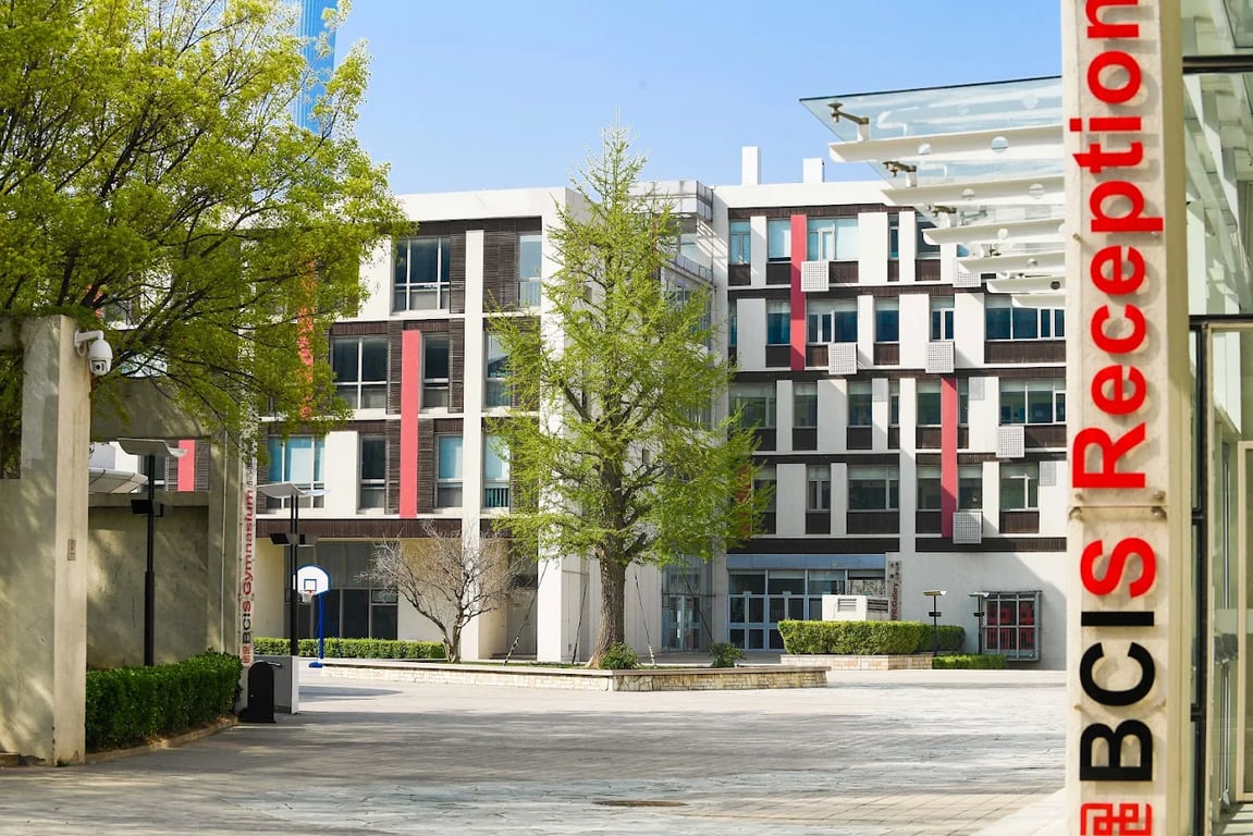 The modern academic buildings and outdoor courtyard at the BCIS campus.