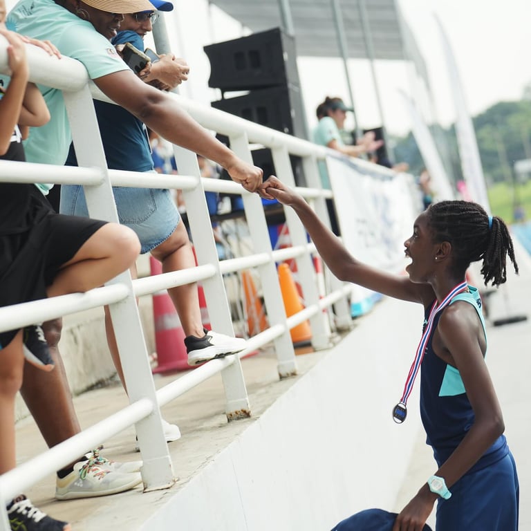 A proud parent-child moment as they celebrate a strong performance on Day 1 of the U11 FOBISIA Games.