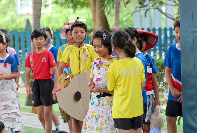 Students dressed up at a "Recycle" show.