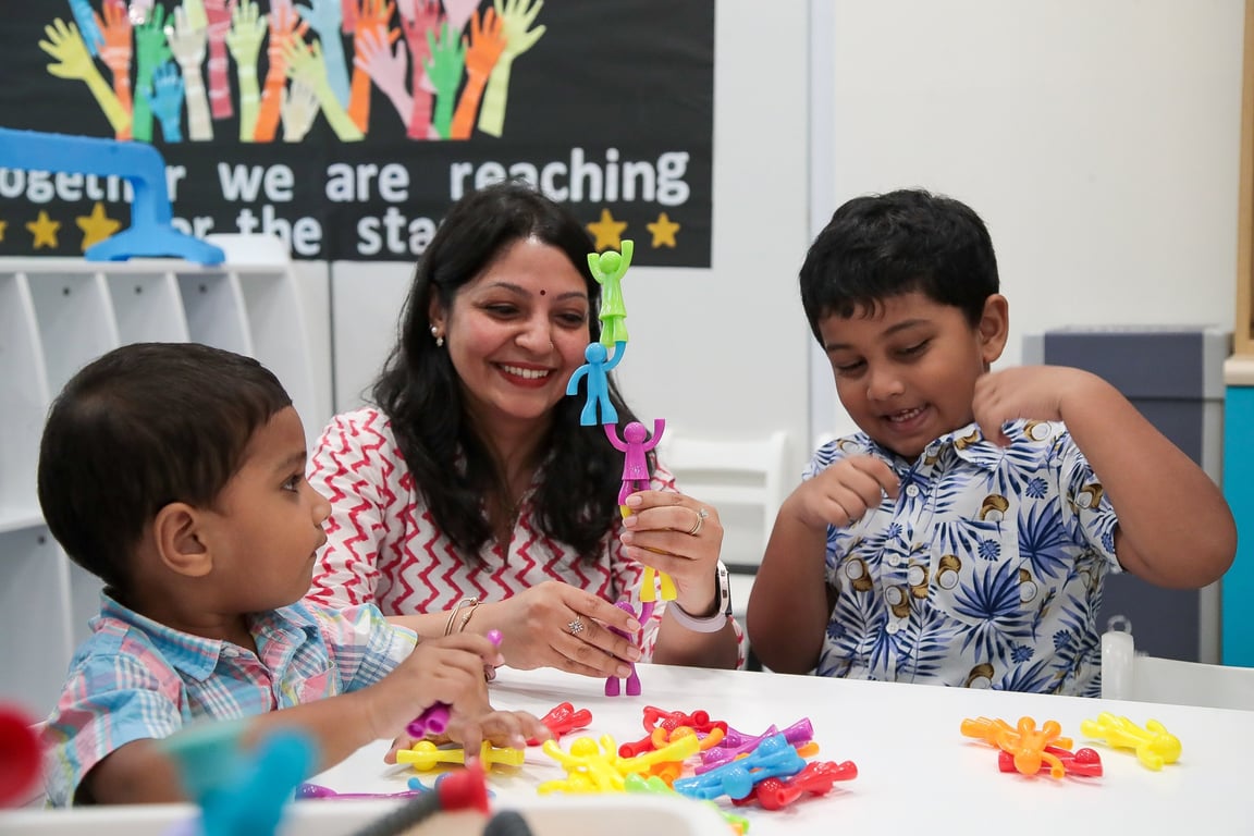 Parents, teachers, and students join the classroom for the Vidyarambam ceremony, where young learners write their first letters and numbers, symbolizing the beginning of a lifelong love for learning.
