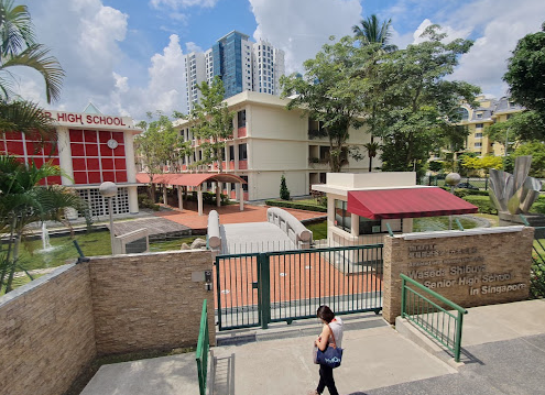 A view of the sprawling campus and  school buildings, taken from the main entrance
