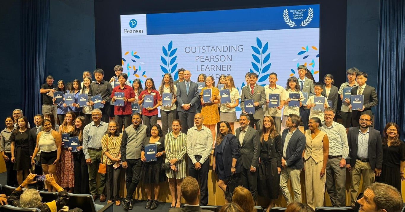 Insworld students celebrate achieving Outstanding Pearson Learner Awards for A-Level exam results at a presentation ceremony