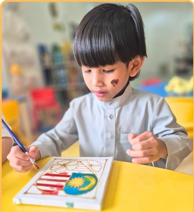 Student sketching in celebration of merdeka.