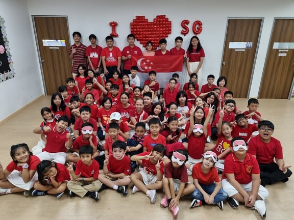 Students dressed up for a school photo on National Day