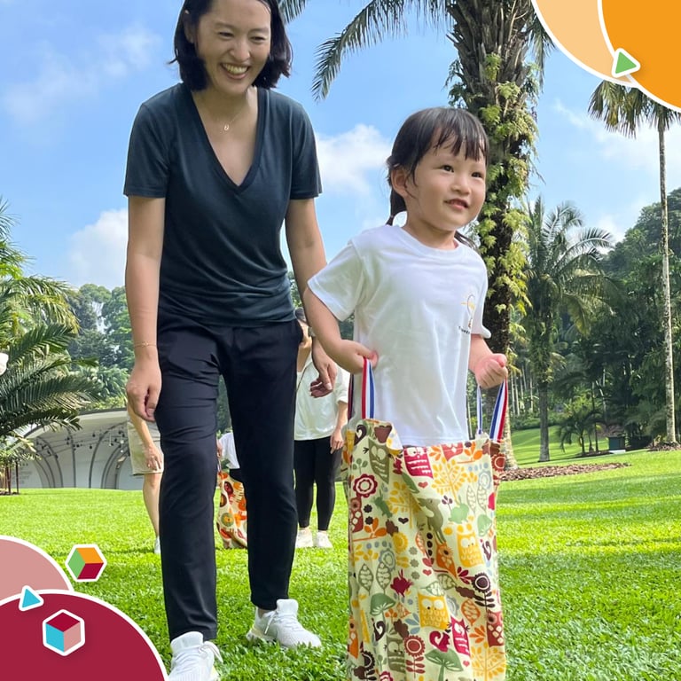 A parent and child enjoying Family Day on campus, a day filled with activities and fun