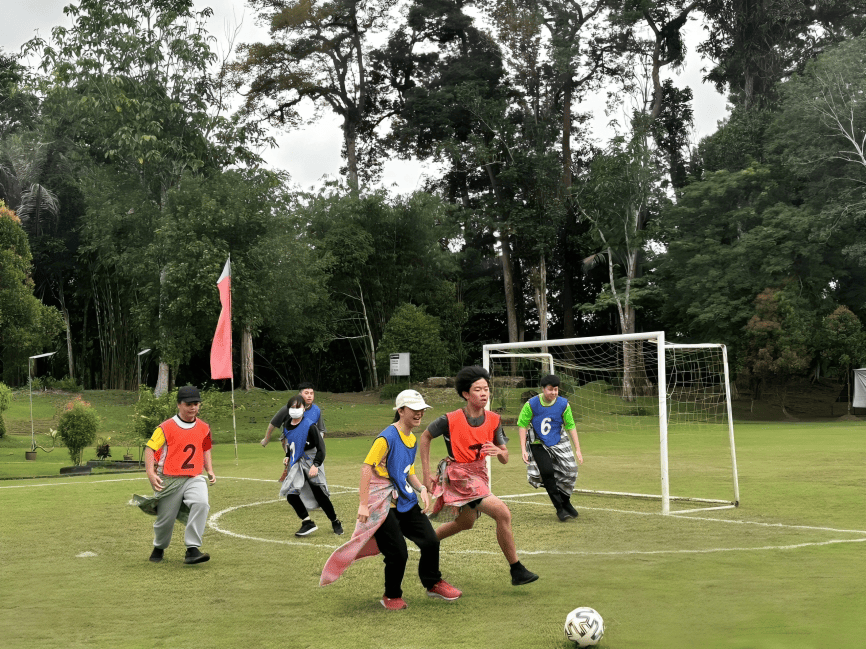 Students combine fun and fitness through creative sports day challenges on the field.