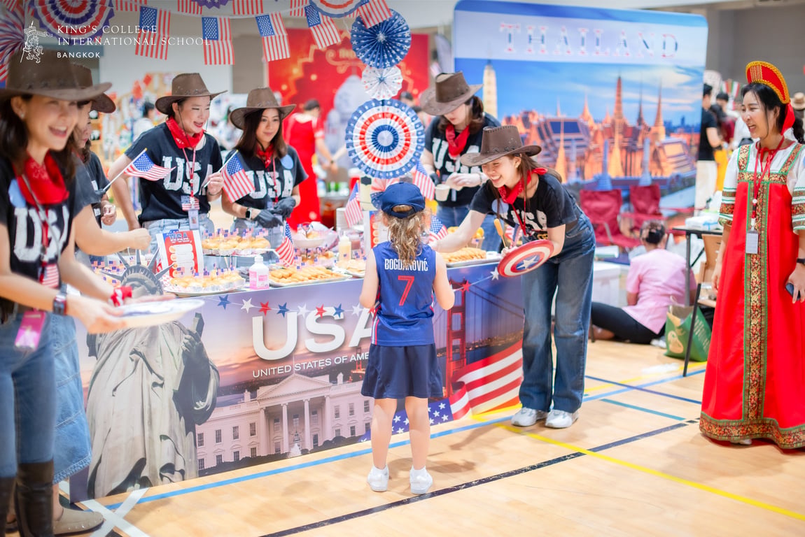 Parents serving global flavors at the international food festival.