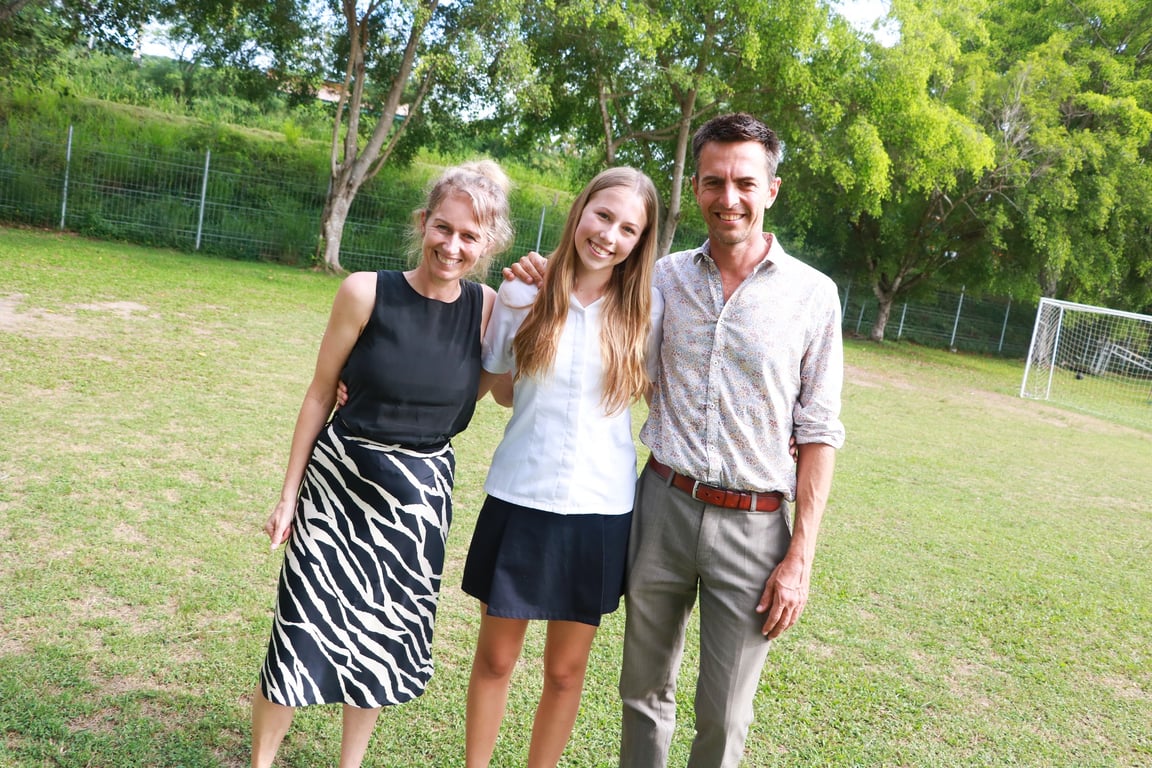 Year 11 student with family at the Leavers Assembly celebration.