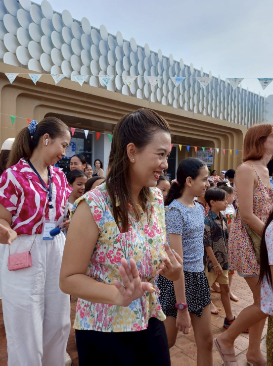 Families gathered outside Finnway for a school community celebration.