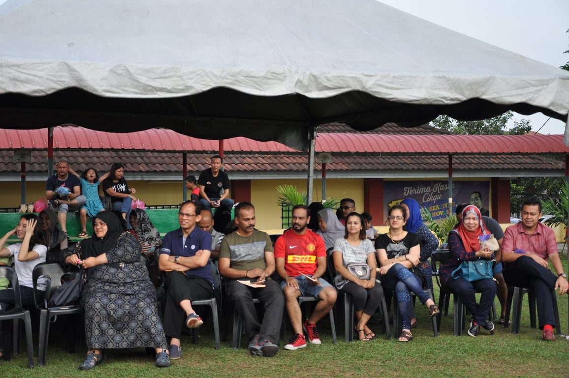 Families attending sports day to show support.