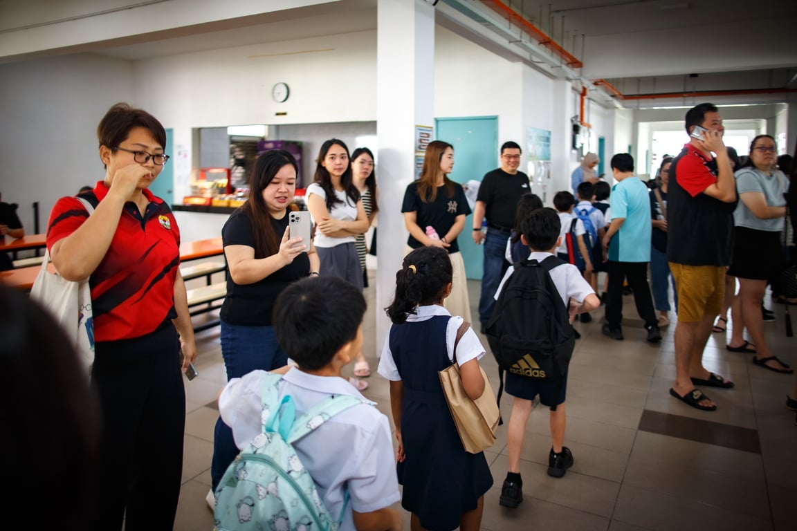 Parents supporting their kids at a spelling bee organized by the school.