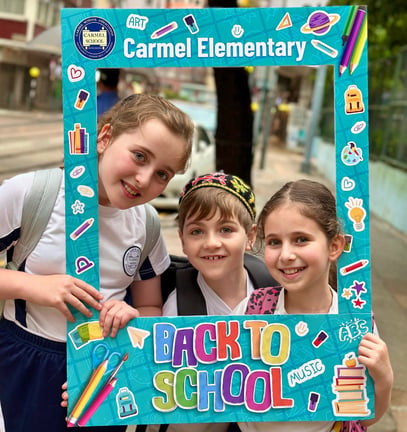 Students celebrating the first day back at Carmel Elementary.