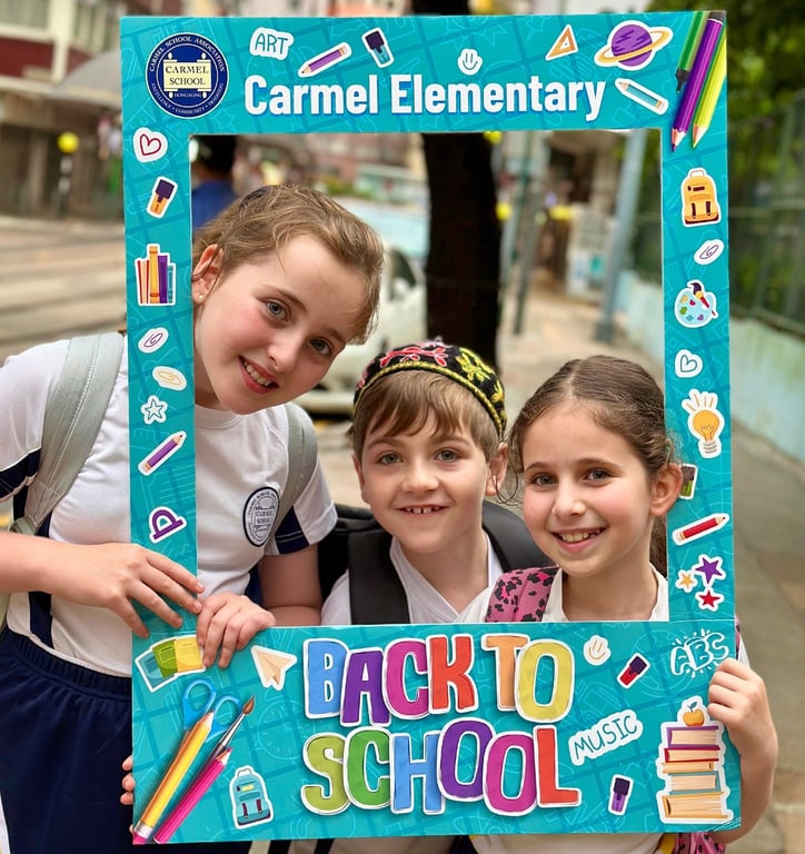 Students celebrating the first day back at Carmel Elementary.