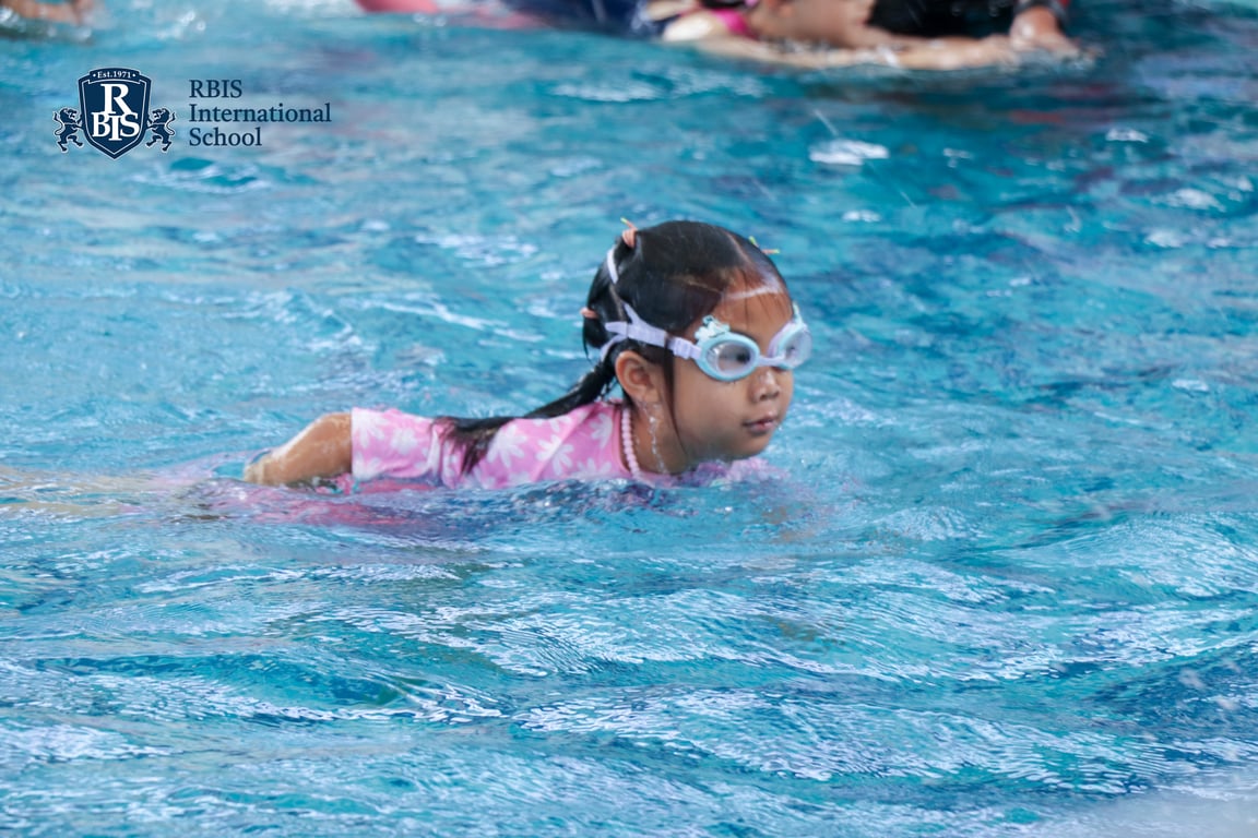 A student swimming during a pool session.