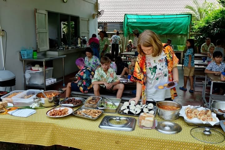 Community meal during school’s Songkran celebration.